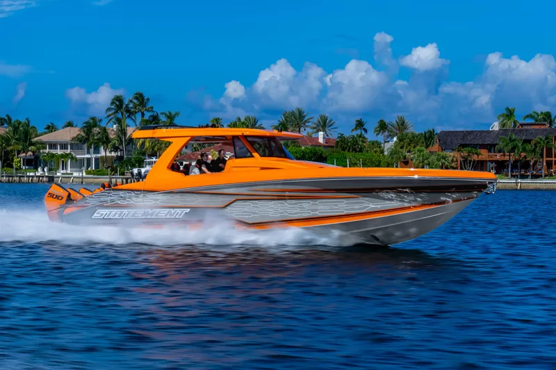 Slide: The Image of Orange Statement 44 GRTS boat cruising on blue water, 2025 model. - 76