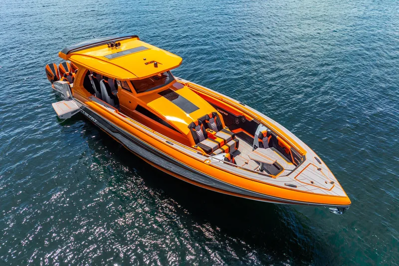 Slide: The Image of 2025 Statement 44 GRTS luxury speedboat in vibrant orange on open water. - 9