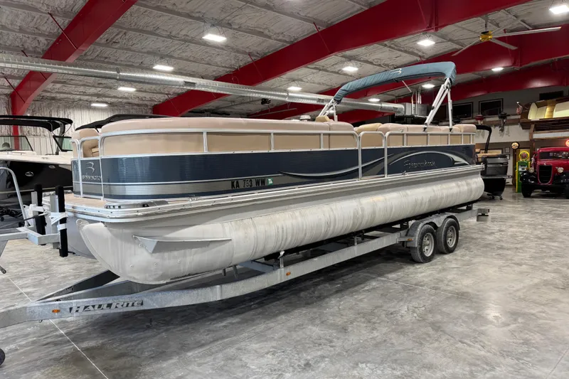 The Image of 2008 Bennington 2575 RL pontoon boat on trailer in indoor storage facility. - 1