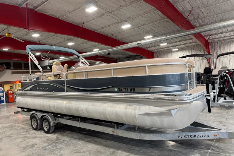 Slide: The Image of 2008 Bennington 2575 RL pontoon boat on trailer in indoor showroom. - 2