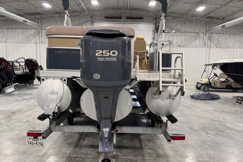 Slide: The Image of 2008 Bennington 2575 RL pontoon boat with 250 four-stroke engine in a warehouse setting. - 7