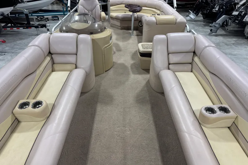 Slide: The Image of 2008 Bennington 2575 RL pontoon boat interior with plush seating and cup holders. - 8