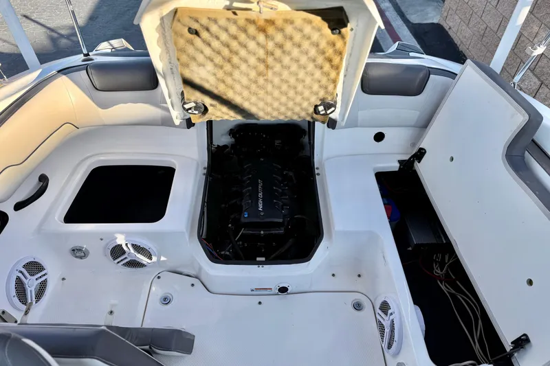 Slide: The Image of 2019 Yamaha Boats SX190 engine compartment with open hatches and visible components. - 16