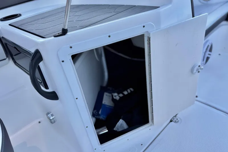 Slide: The Image of Open storage compartment on 2019 Yamaha Boats SX190, showcasing interior space. - 20