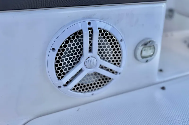 Slide: The Image of Close-up of a 2019 Yamaha SX190 boat speaker and control panel. - 21