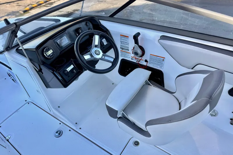 Slide: The Image of 2019 Yamaha Boats SX190 cockpit with steering wheel and control panel. - 22