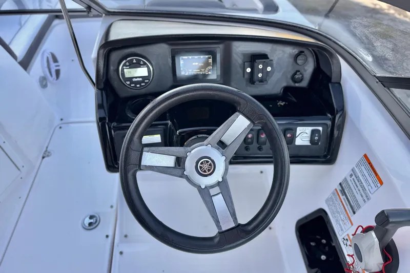 Slide: The Image of 2019 Yamaha Boats SX190 dashboard with steering wheel and control panel. - 23