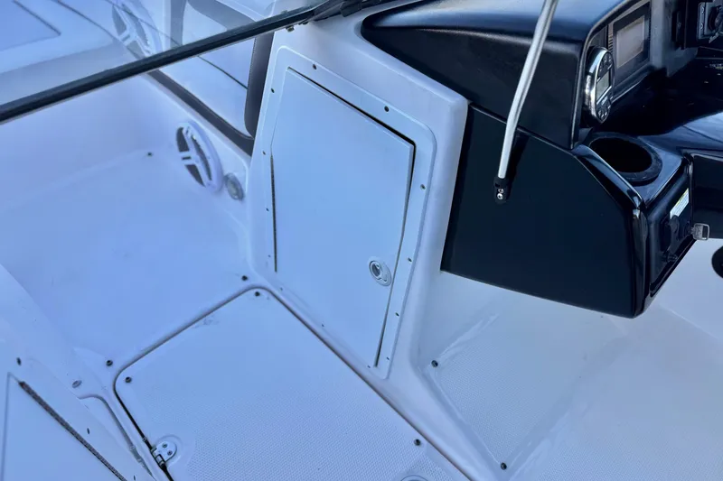 Slide: The Image of 2019 Yamaha Boats SX190 interior dashboard and storage compartment. - 26