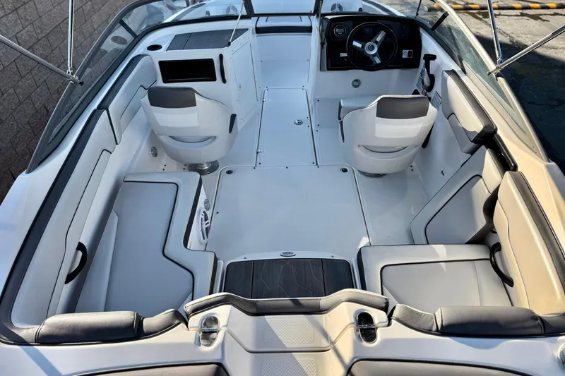 Slide: The Image of 2019 Yamaha Boats SX190 interior with seating and steering wheel, showcasing modern design. - 9