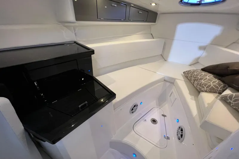 Slide: The Image of Luxurious interior of 2023 Schaefer 303 Sport boat with modern amenities and elegant seating. - 8