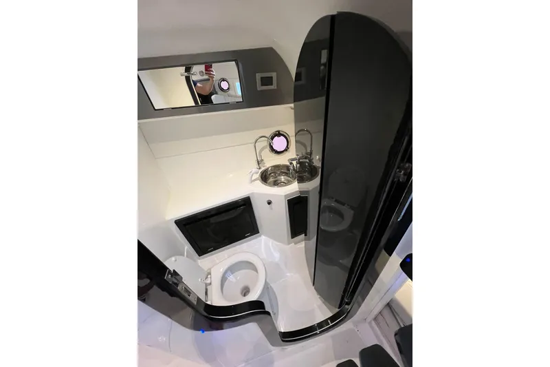 Slide: The Image of 2023 Schaefer 303 Sport boat bathroom with modern fixtures and compact design. - 9