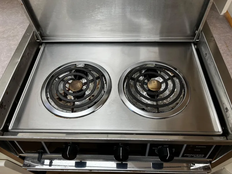 Slide: The Image of Stainless steel two-burner stove in 1996 Carver 325 Aft Cabin yacht kitchen. - 27