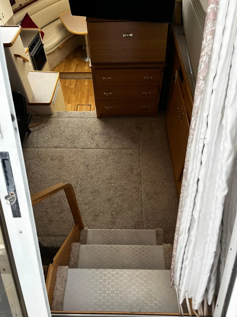 Slide: The Image of 1996 Carver 325 Aft Cabin kitchen with microwave, sink, and appliances. - 22