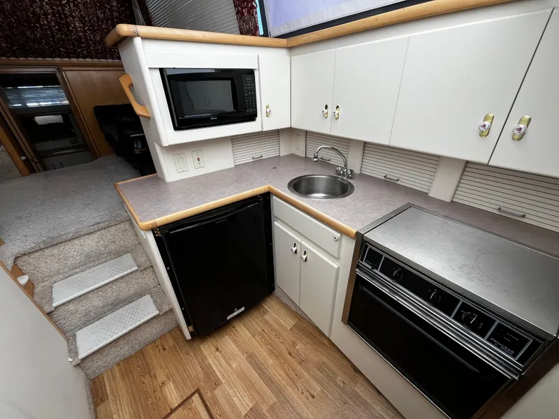 Slide: The Image of Interior view of 1996 Carver 325 Aft Cabin, showing stairs and cabin entrance. - 26