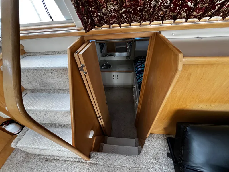 Slide: The Image of Bathroom interior of 1996 Carver 325 Aft Cabin yacht, featuring sink and toilet. - 31