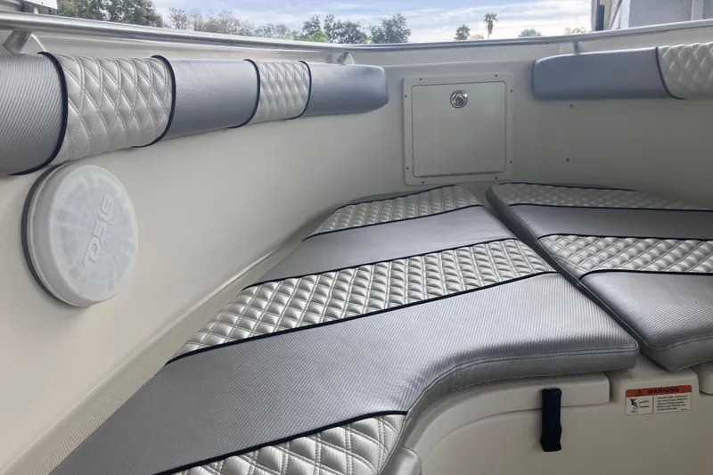 Slide: The Image of 2008 Hydra-Sports Vector 2900 CC boat interior with cushioned seating and speaker. - 21