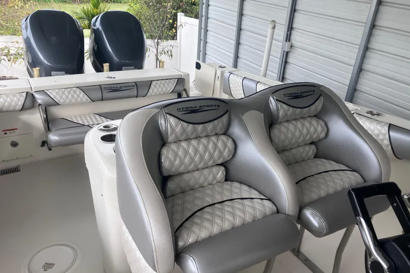 Slide: The Image of 2008 Hydra-Sports Vector 2900 CC boat interior with cushioned seating and dual engines. - 26