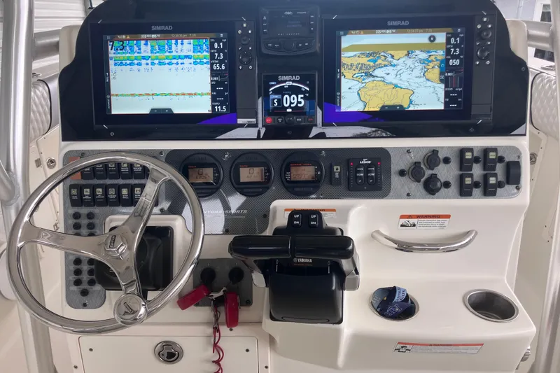 Slide: The Image of 2008 Hydra-Sports Vector 2900 CC dashboard with Simrad navigation displays and Yamaha controls. - 27