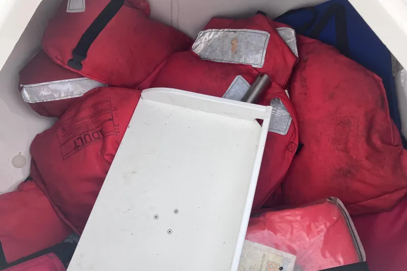 Slide: The Image of Red life jackets stored in a 2008 Hydra-Sports Vector 2900 CC boat compartment. - 39