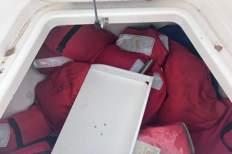 Slide: The Image of Storage compartment of 2008 Hydra-Sports Vector 2900 CC with red life jackets. - 40