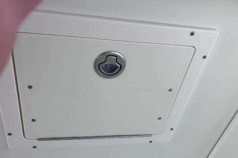 Slide: The Image of Hatch door on 2008 Hydra-Sports Vector 2900 CC boat, featuring a metal handle. - 45