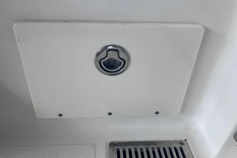 Slide: The Image of 2008 Hydra-Sports Vector 2900 CC boat compartment with chrome handle and drainage grate. - 57