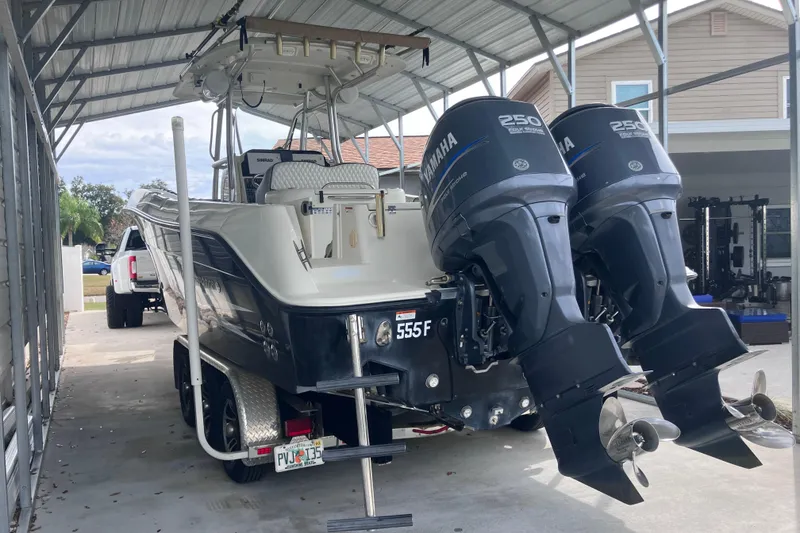 Slide: The Image of 2008 Hydra-Sports Vector 2900 CC boat with twin Yamaha 250 engines in a covered storage. - 7