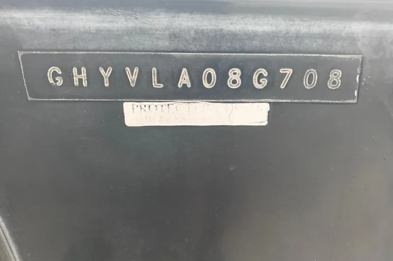 Slide: The Image of 2008 Hydra-Sports Vector 2900 CC hull identification number (HIN) on black surface. - 71