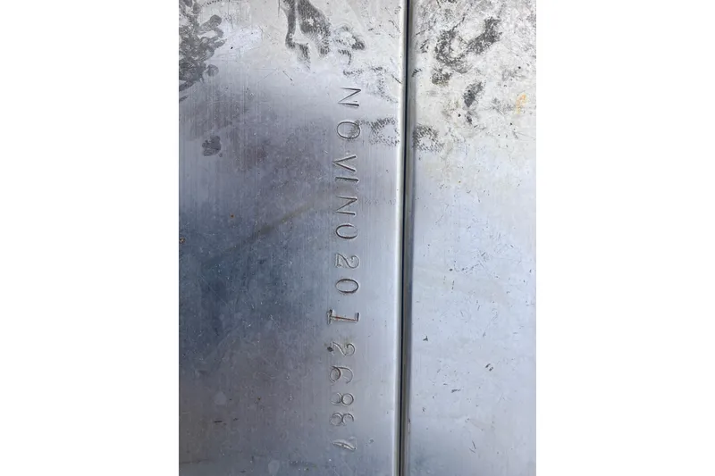 Slide: The Image of Close-up of a metal surface with engraved serial number, Hydra-Sports Vector 2900 CC, 2008. - 72