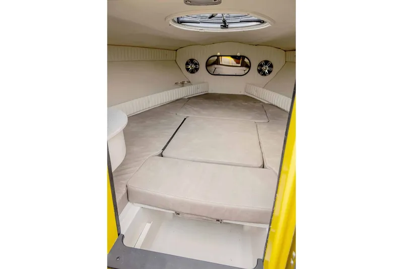 Slide: The Image of 2025 Stingray 23 OCX boat on trailer, Suzuki engine. - 10