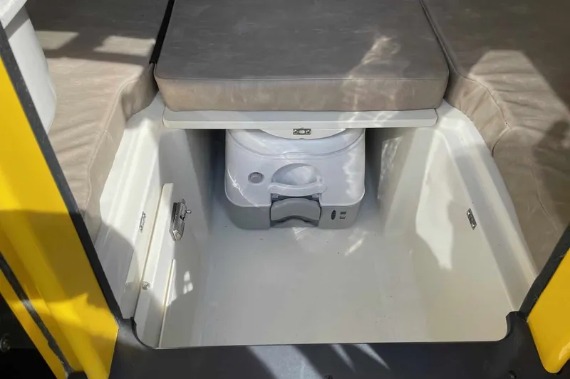 Slide: The Image of Underside of a 2025 Stingray 23 OCX boat on a trailer. - 11