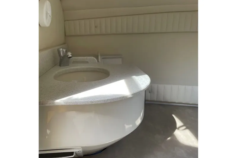 Slide: The Image of Underside of a 2025 Stingray 23 OCX boat on a trailer. - 12