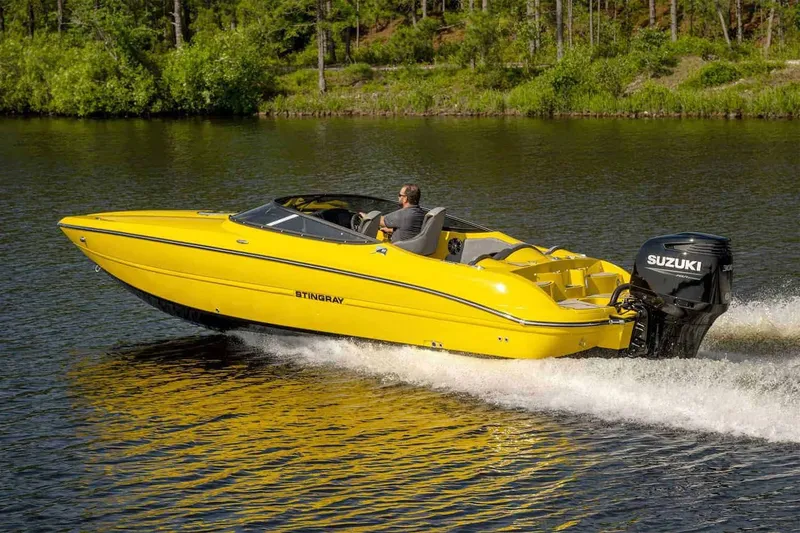 Slide: The Image of Rear view of a Stingray 23 OCX boat on a trailer, 2025 model. - 15