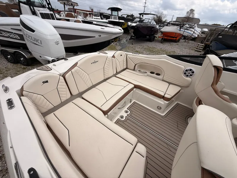 Slide: The Image of Interior of 2025 Stingray 23 OCX with beige seating. - 26