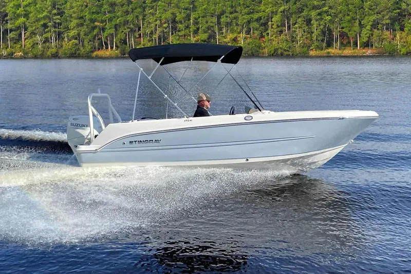 Slide: The Image of Interior of 2025 Stingray 172 DC boat with steering console. - 13