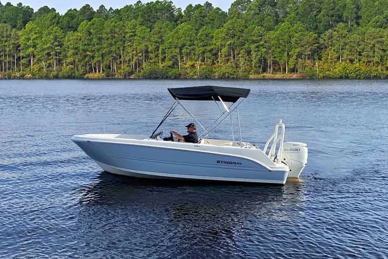 Slide: The Image of Interior of 2025 Stingray 172 DC boat with white seating. - 14