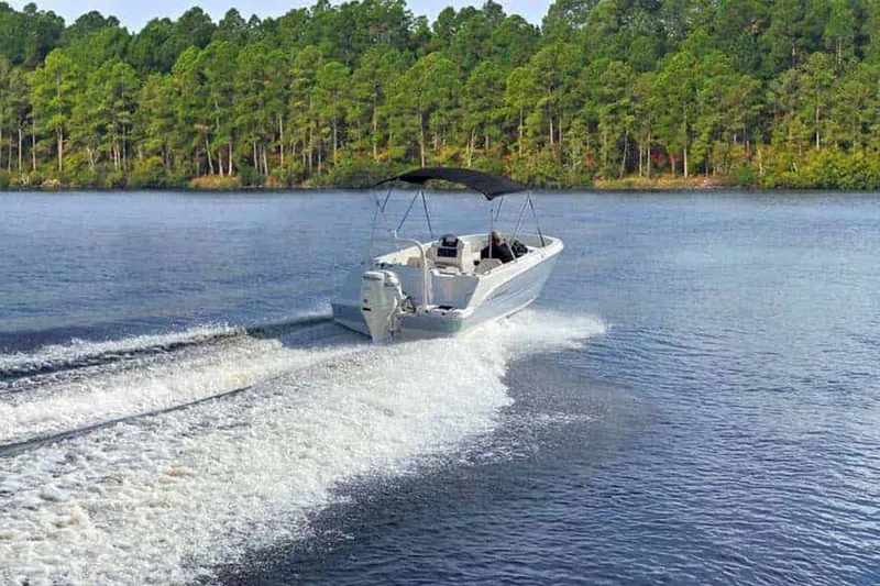 Slide: The Image of 2025 Stingray 172 DC boat on trailer in warehouse. - 15