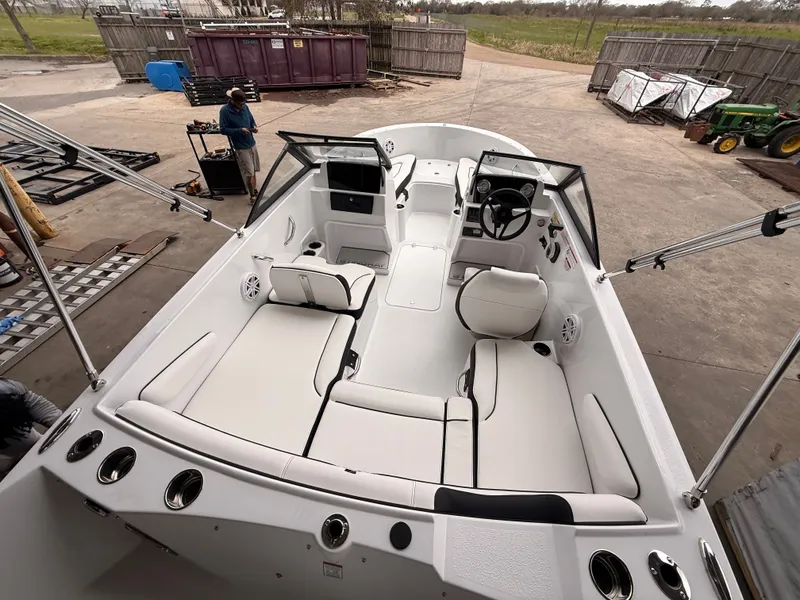 Slide: The Image of 2025 Stingray 172 DC boat interior with seating and steering wheel. - 20