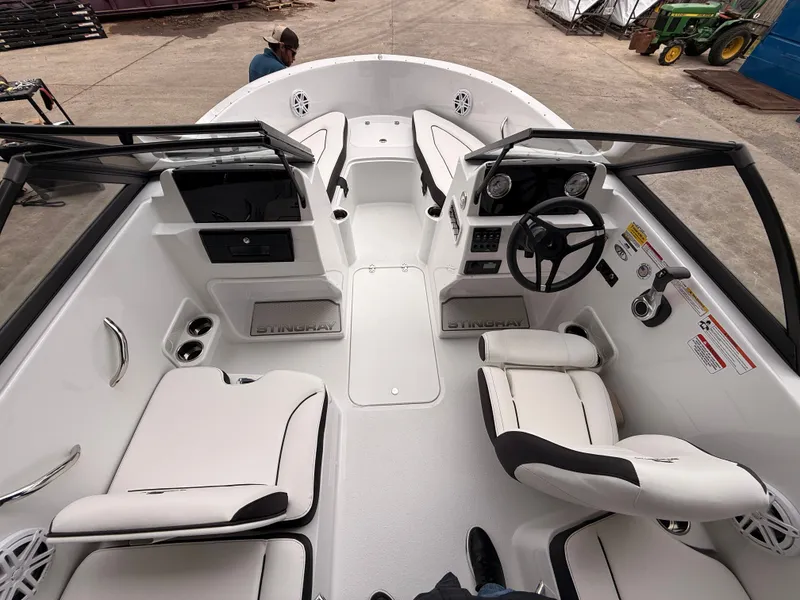 Slide: The Image of Interior view of 2025 Stingray 172 DC boat with white seating. - 21