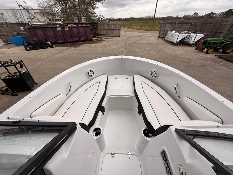 Slide: The Image of Interior view of 2025 Stingray 172 DC boat with white seating. - 23
