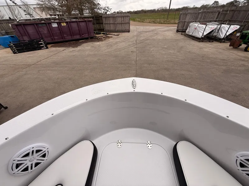 Slide: The Image of Stingray 172 DC 2025 boat parked in a storage area. - 25