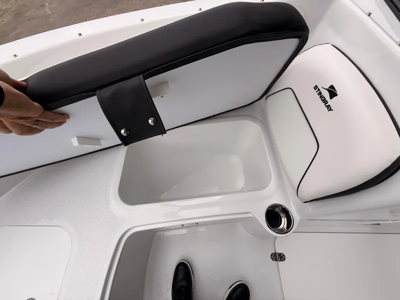 Slide: The Image of Interior view of 2025 Stingray 172 DC boat with storage compartment. - 27