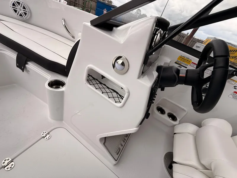 Slide: The Image of Interior of 2025 Stingray 172 DC boat with steering console. - 34