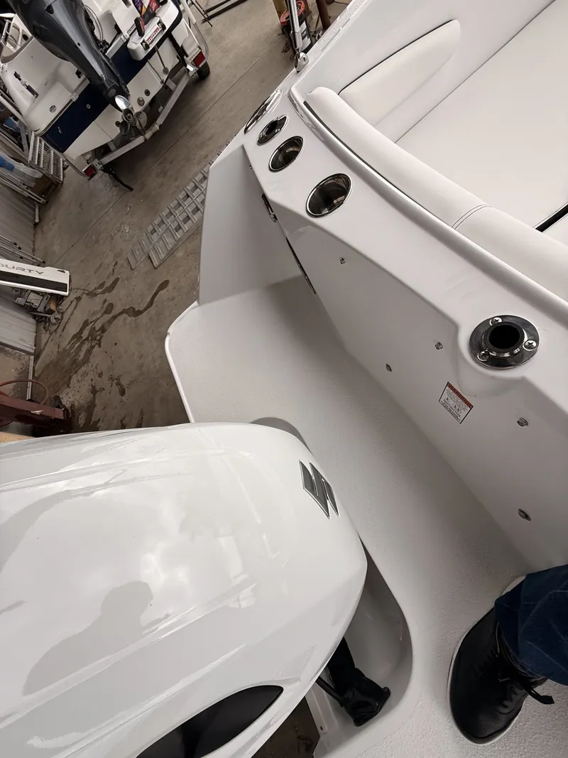 Slide: The Image of Interior view of 2025 Stingray 172 DC boat with engine. - 39