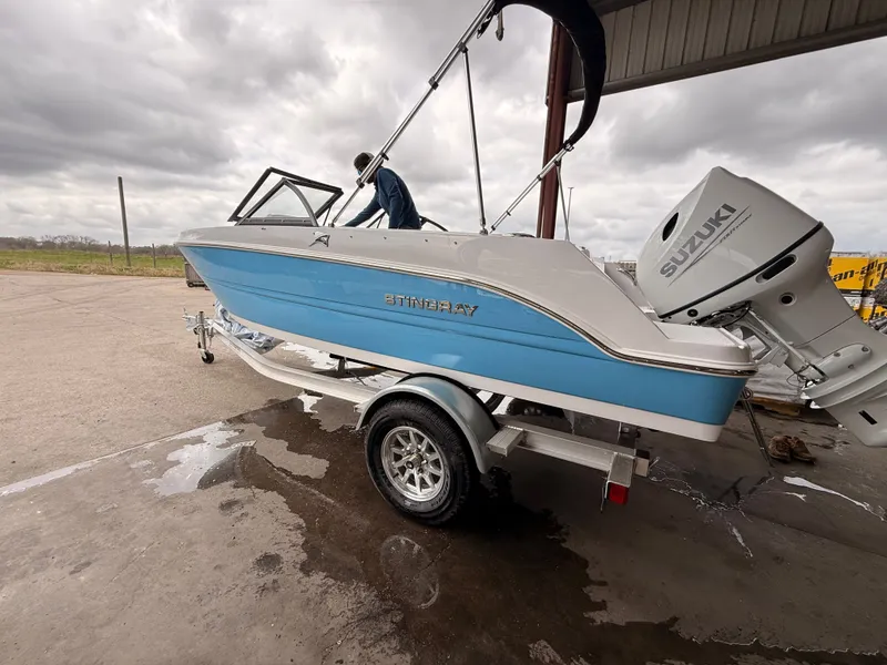 Slide: The Image of 2025 Stingray 172 DC boat with Suzuki engine on trailer. - 43