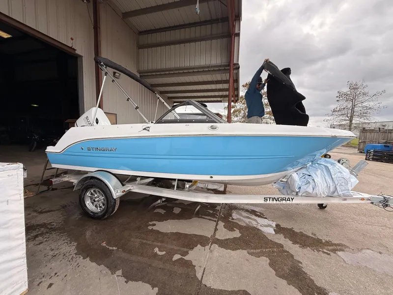 Slide: The Image of 2025 Stingray 172 DC boat on trailer in warehouse. - 46