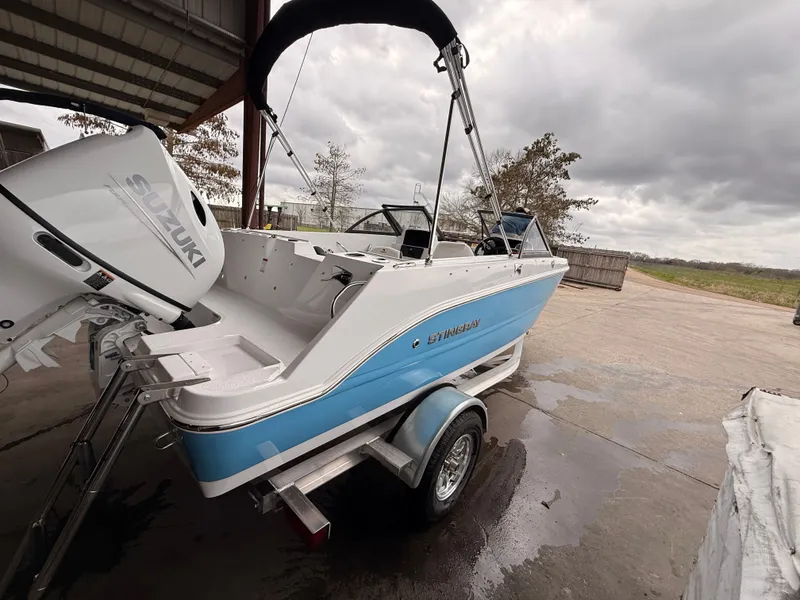 Slide: The Image of 2025 Stingray 172 DC boat with Suzuki outboard motor. - 47