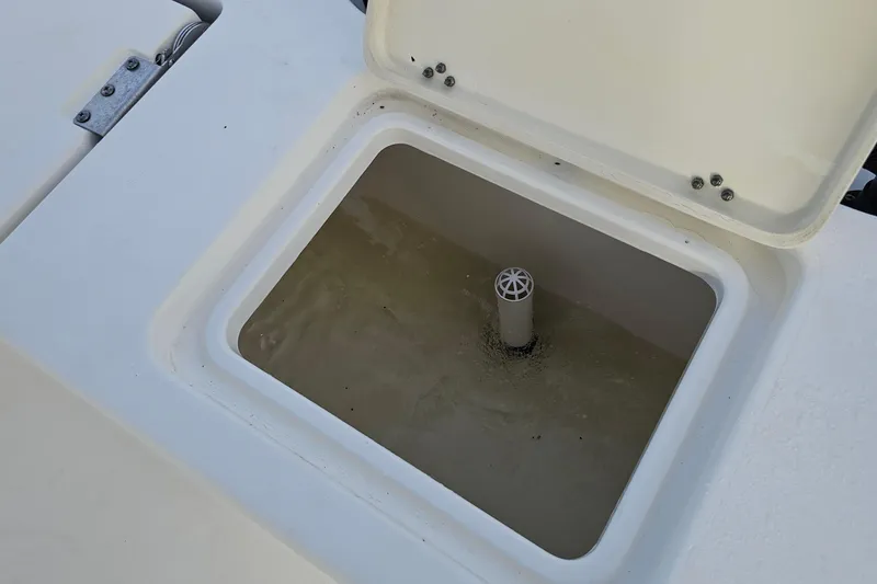 Slide: The Image of Open storage compartment on 2021 NauticStar 191 Hybrid boat. - 10