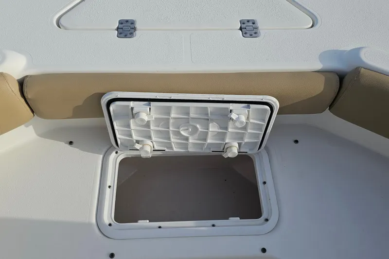 Slide: The Image of 2021 NauticStar 191 Hybrid boat storage compartment with open hatch. - 11