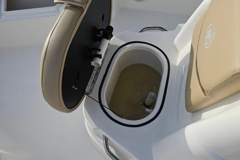 Slide: The Image of 2021 NauticStar 191 Hybrid boat with open livewell and cushioned seating. - 14